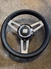 Uflex Morosini 13.8" Steering Wheel Featuring Black Leather And Chrome Hub New. Price: $300.00.